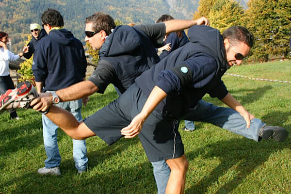 A team working through an outdoor exercise in the open air