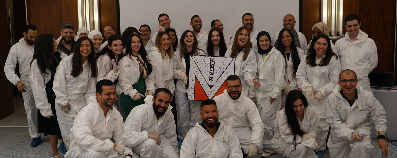 A large team in forensic suits at the end of a CSI activity